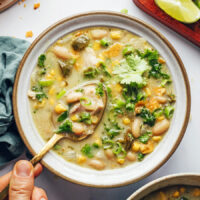 Spoon picking up a bite of our white bean chicken chili