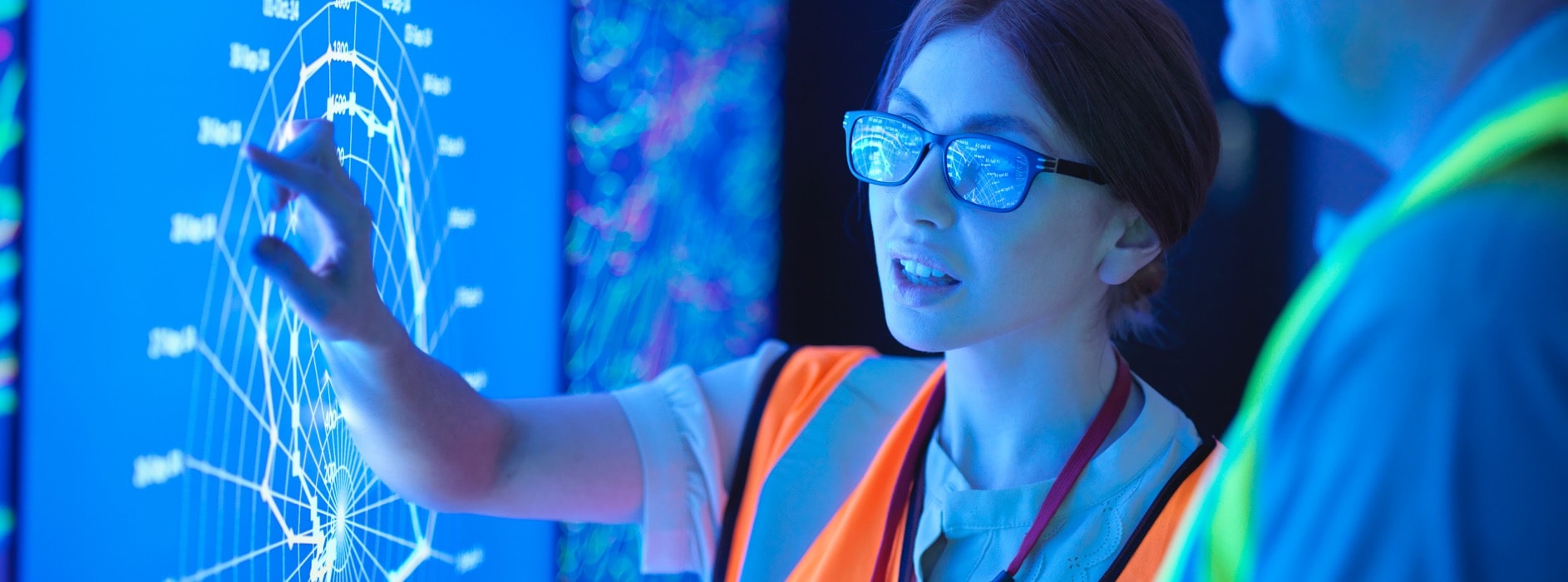 Image of a woman working on a computer in light filled office