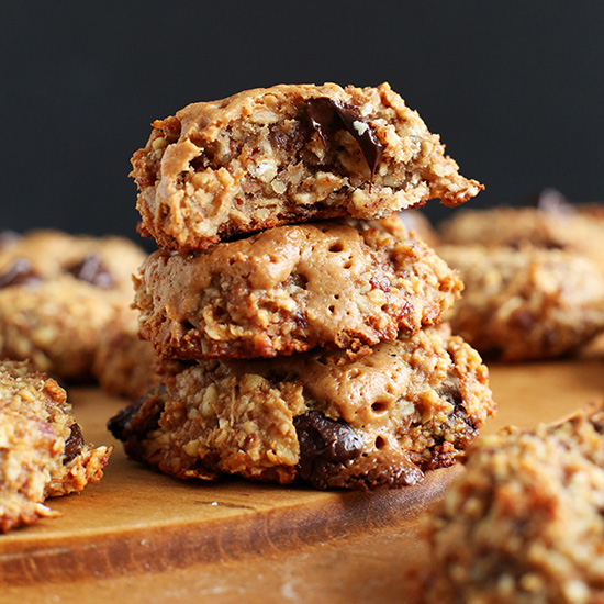 Stack of Gluten-Free Vegan Peanut Butter Chocolate Chip Cookies on a cutting board