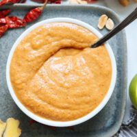 Spoon in a bowl of homemade panang curry paste