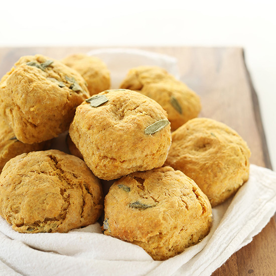 Batch of Pumpkin Sage Biscuits on a white towel on a cutting board