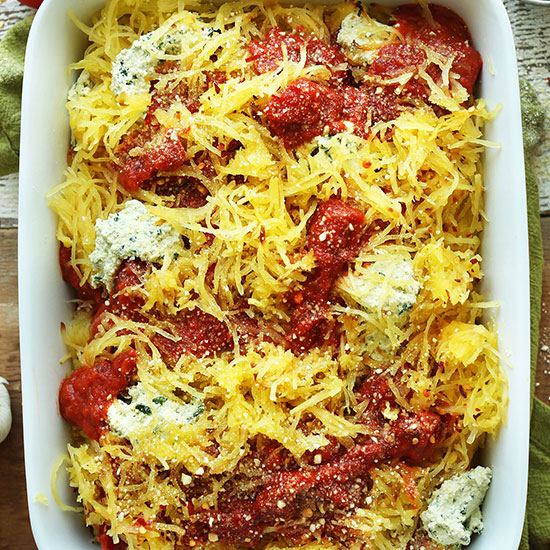 Top down shot of a ceramic dish filled with Vegan Spaghetti Squash Lasagna Bake