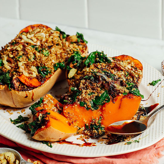 Two Stuffed Butternut Squash halves on a platter